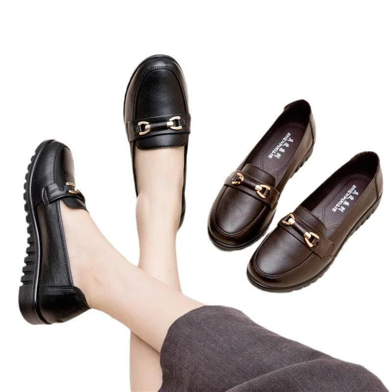 Black women's casual slip-on pumps with round toe and low flat heel on a rubber sole.