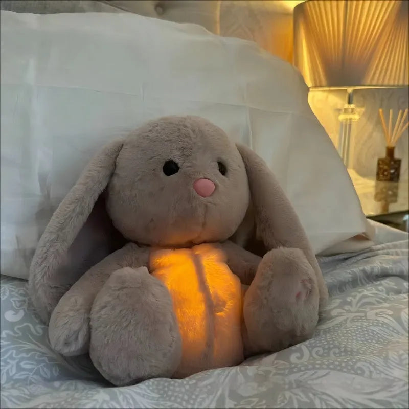 Breathing rabbit plush toy with moving belly and calming features for baby sensory development