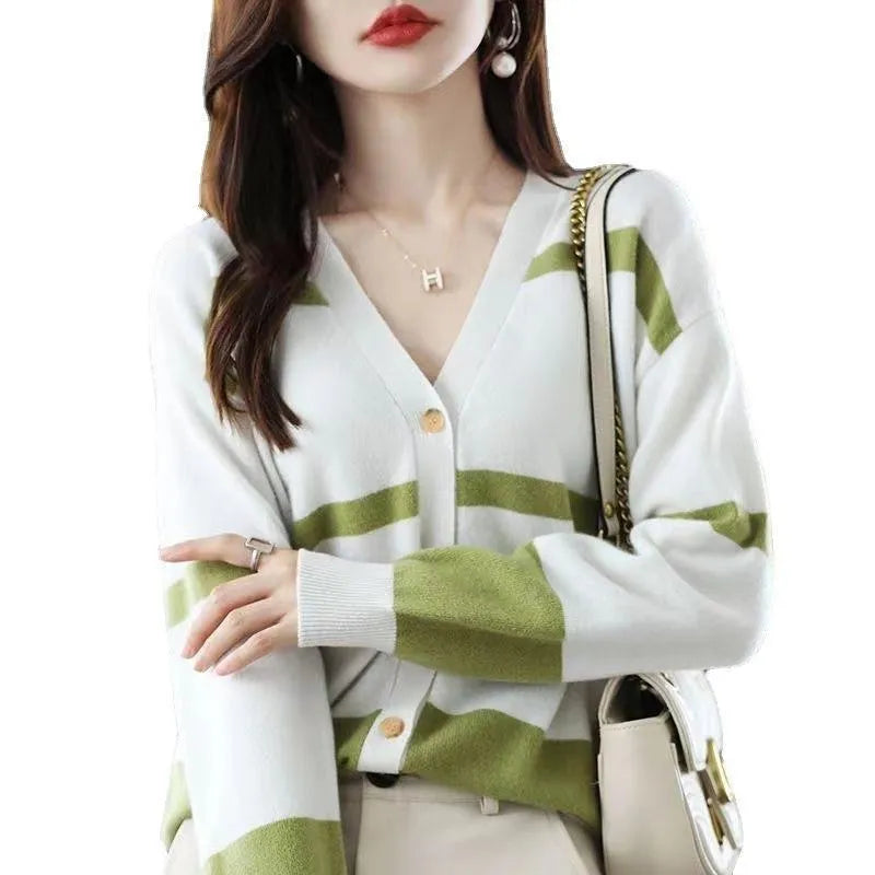 Women's striped V-neck cardigan with a raised 3D pattern, shown buttoned.