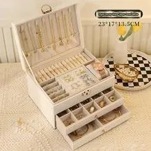 Leather jewellery storage box with three drawers open showing removable dividers and satin lining in four colour options
