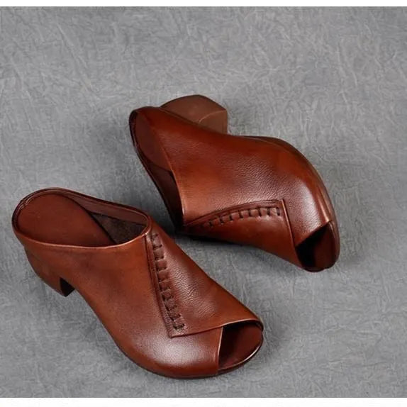Women's black peep-toe slipper with a square heel and fish mouth opening, shown on a white background.