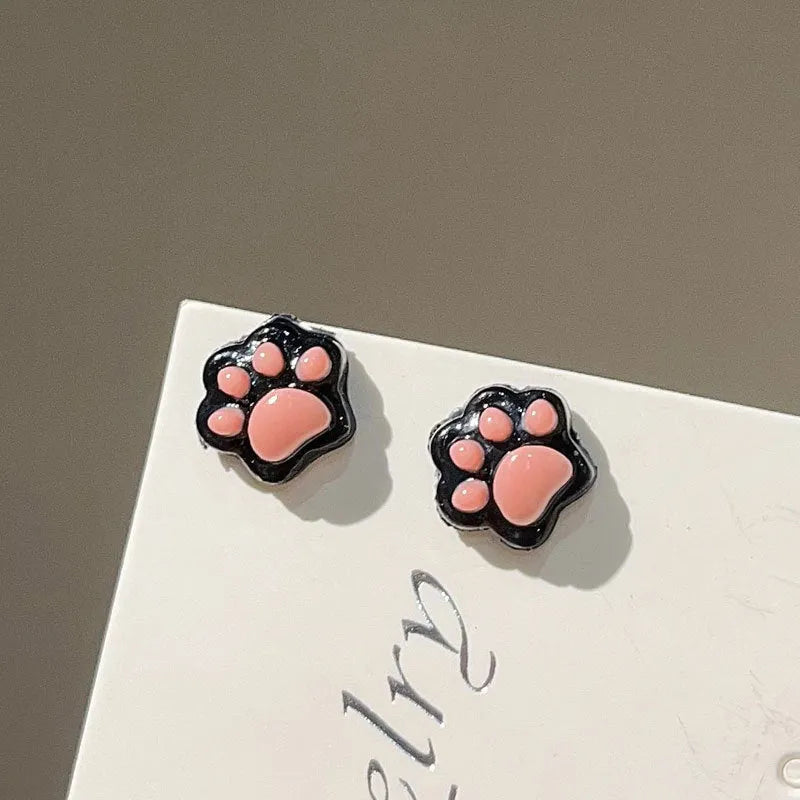 Cat paw magnetic ear clips in transparent pink colour, plastic resin material, animal zodiac style for women