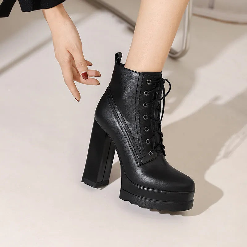 Women's black waterproof cowhide leather ankle boots with a chunky heel and side zip