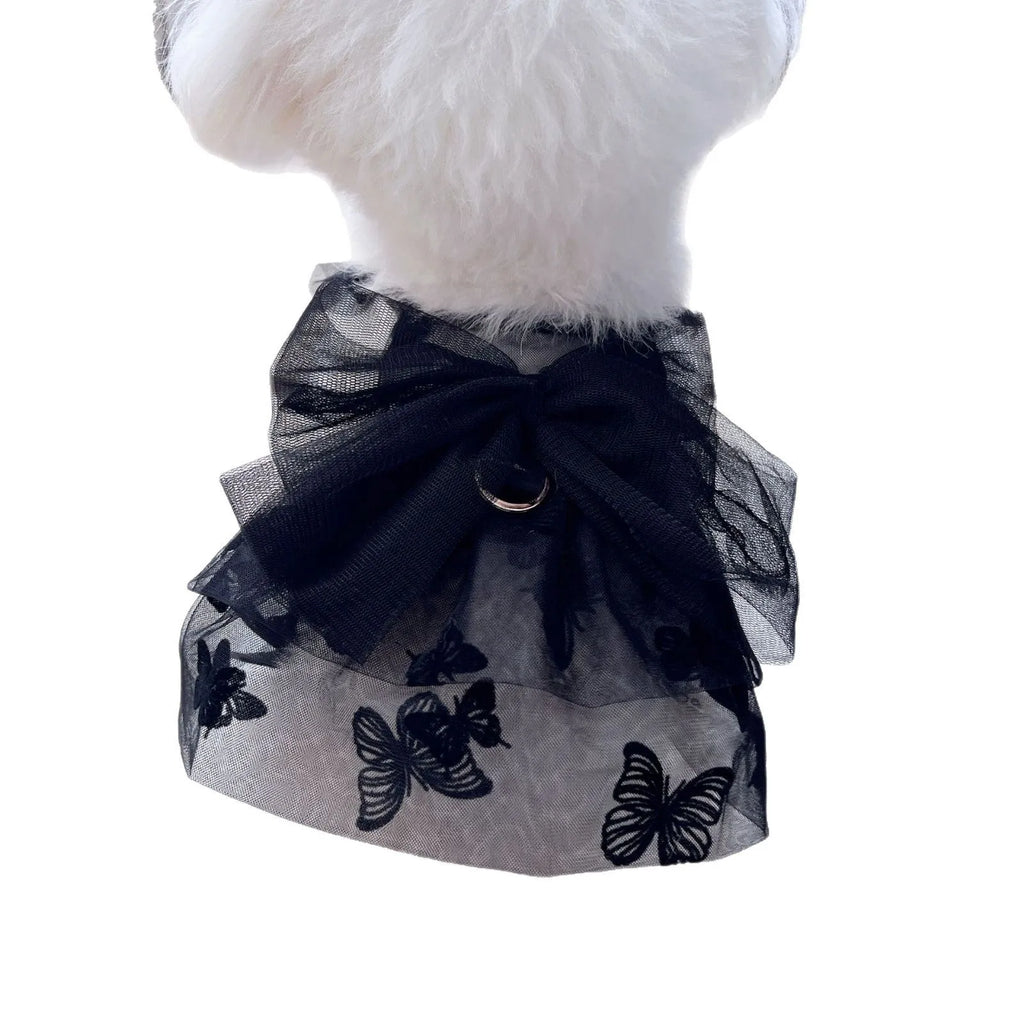 Black layered tulle princess skirt on a small dog, showing elastic waistband and tiered design.