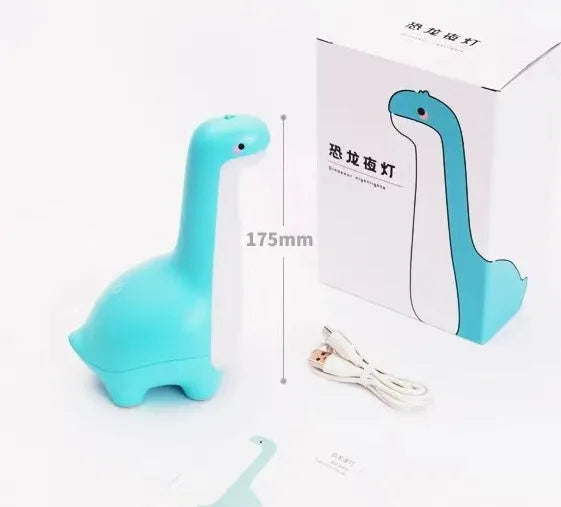 Dinosaur night light in lemon yellow with warm 3000K glow on a bedside table, USB charging cable included