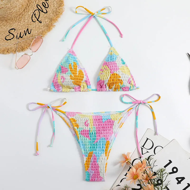 Women's triangle bag bikini swimsuit with printed floral gradient pattern and smocking detail