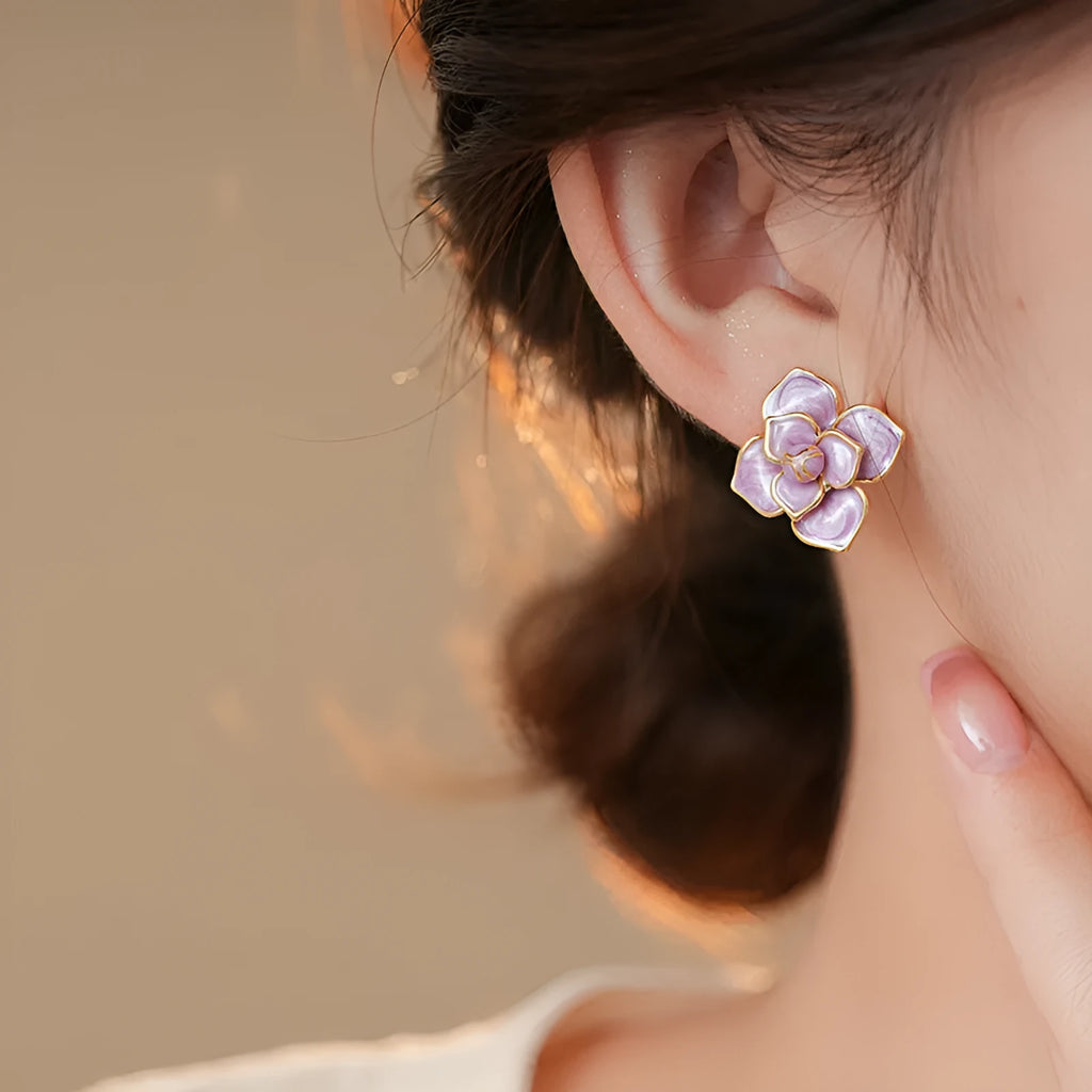 Golden-purple oil-spot glaze flower stud earrings on a copper base with surgical steel posts.