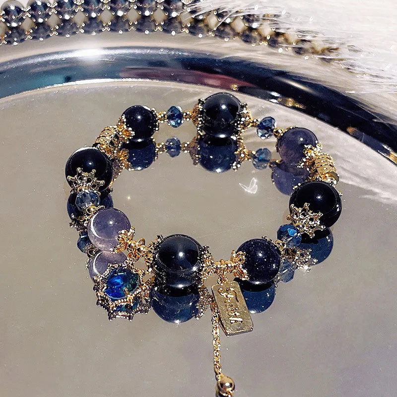 Women's galaxy-coloured alloy bracelet with bow and snowflake pendant charm