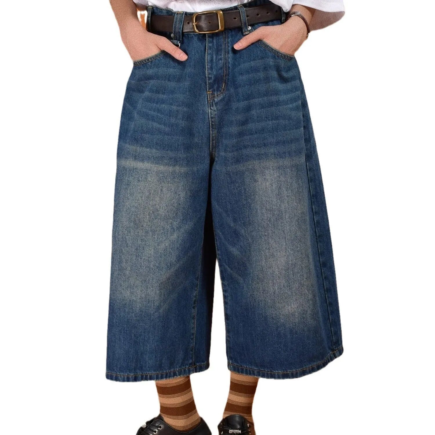 Men's loose-fit straight-leg denim shorts in a light blue wash on a hanger.