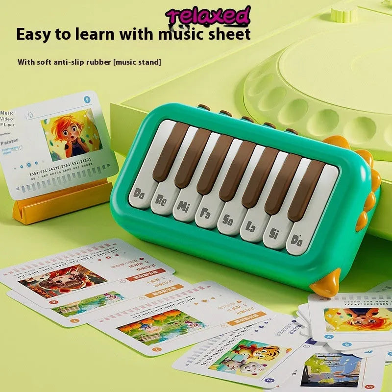 Pocket electronic keyboard little piano pattern toy for children in green and pink plastic.
