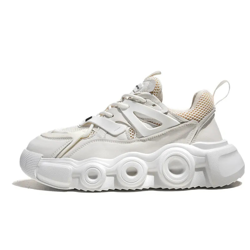 Men's low-top casual sneaker in grey with mesh upper, thick rubber sole, and round toe.