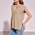 Camel and white v-neck sleeveless loose pullover vest in striped or plaid patterns