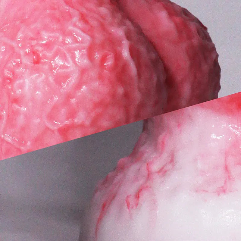 Pink penis-shaped adult masturbation toy made of platinum silicone, showing Berserker model.