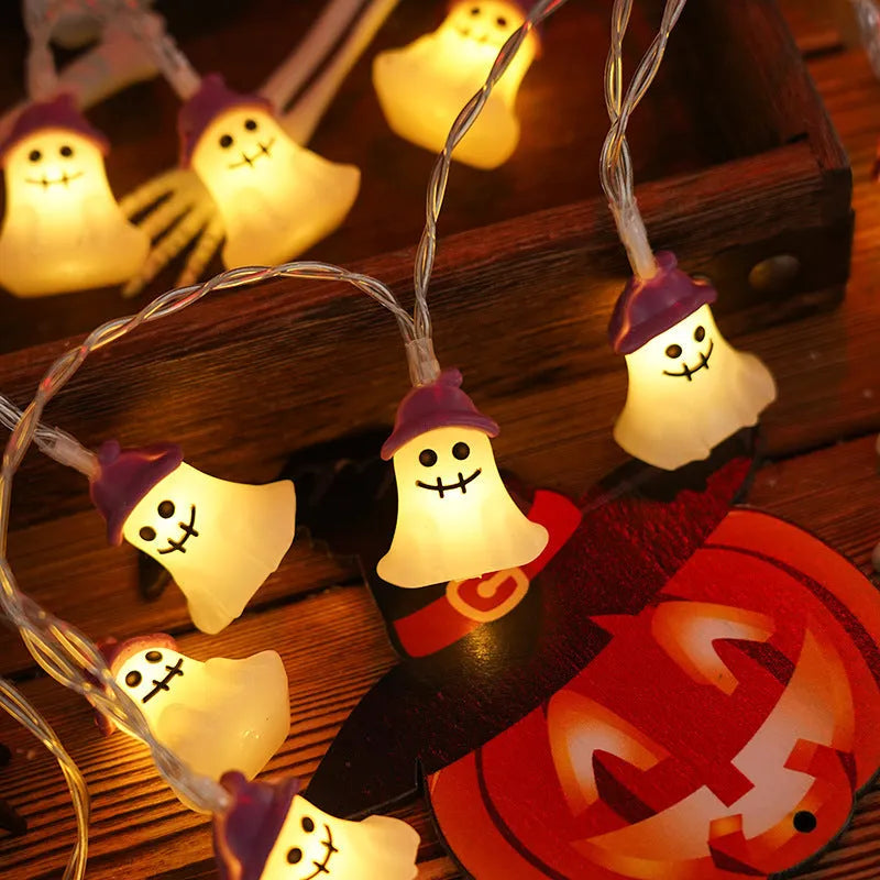 PVC Halloween lighting chain with pumpkin, ghost and bat shapes in warm white LED glow