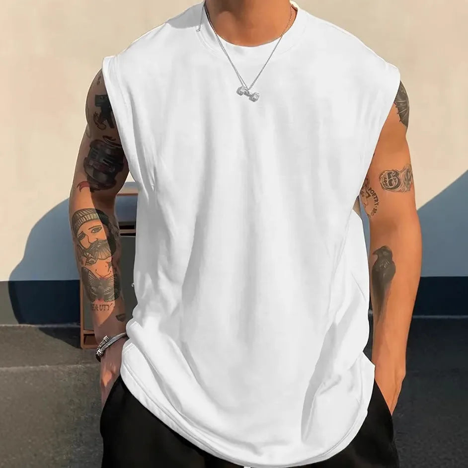 Men's loose solid colour cotton sleeveless tank top on a hanger, showing straight hem design.