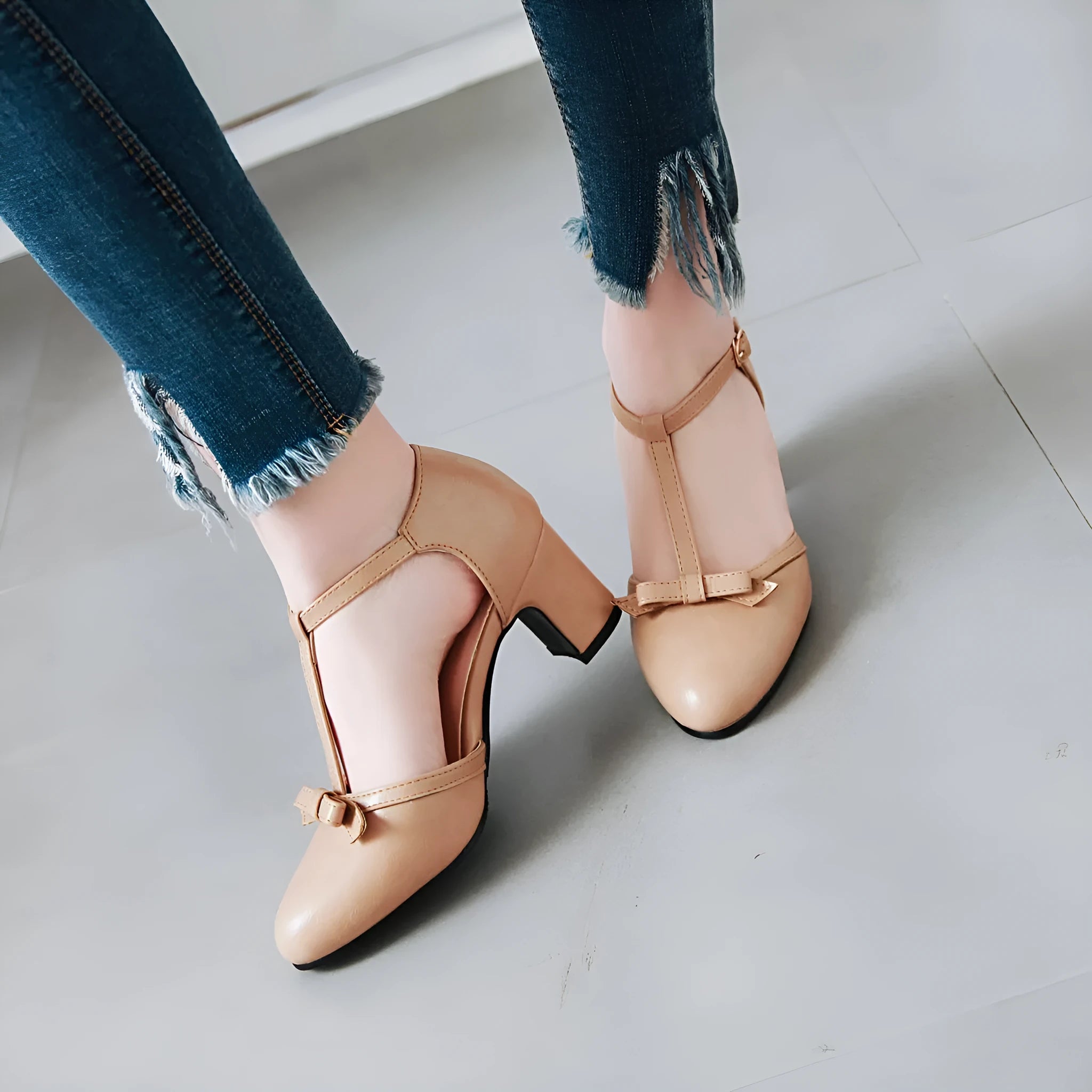 Yellow women's sandals with a chunky block heel, hollow-out design, and a buckle strap.
