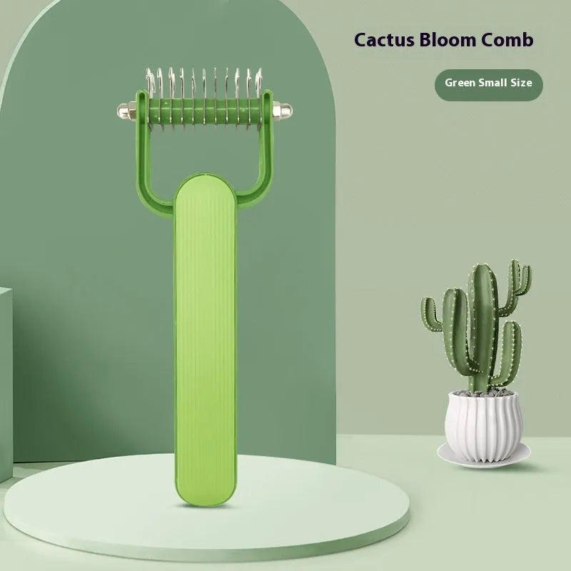 Green and grey pet hair unknotting comb for dogs with stainless steel teeth.
