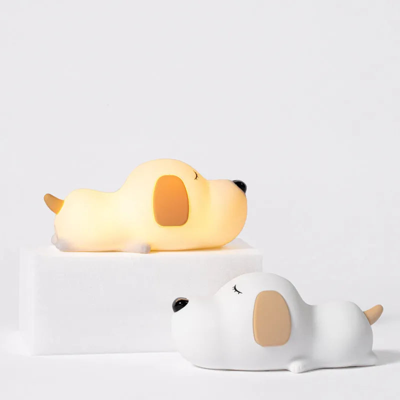 Silicone cartoon dog night lamp in two colours with a USB charging cable.