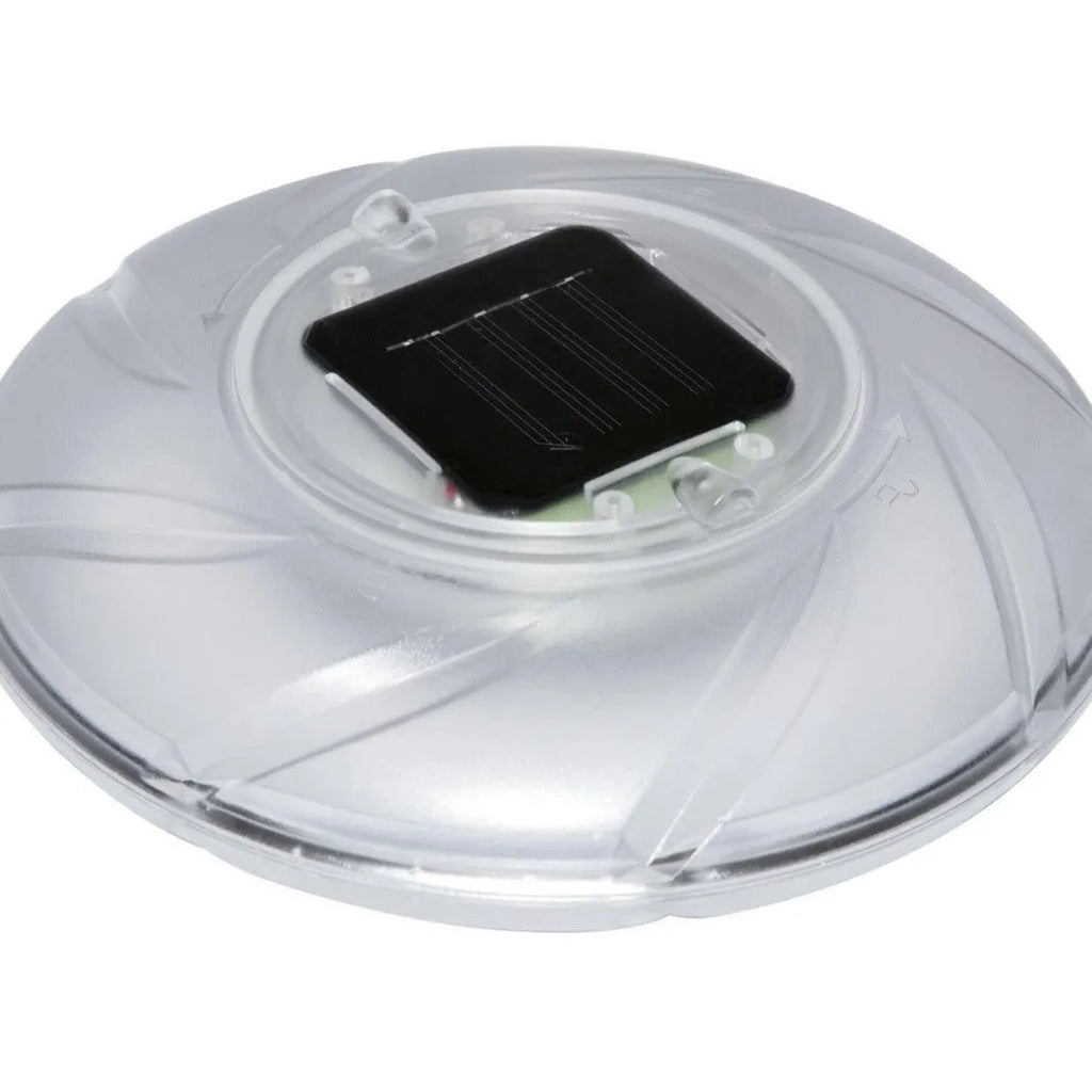Bestway 58111 solar floating light floating on pool water surface with sunlight reflecting