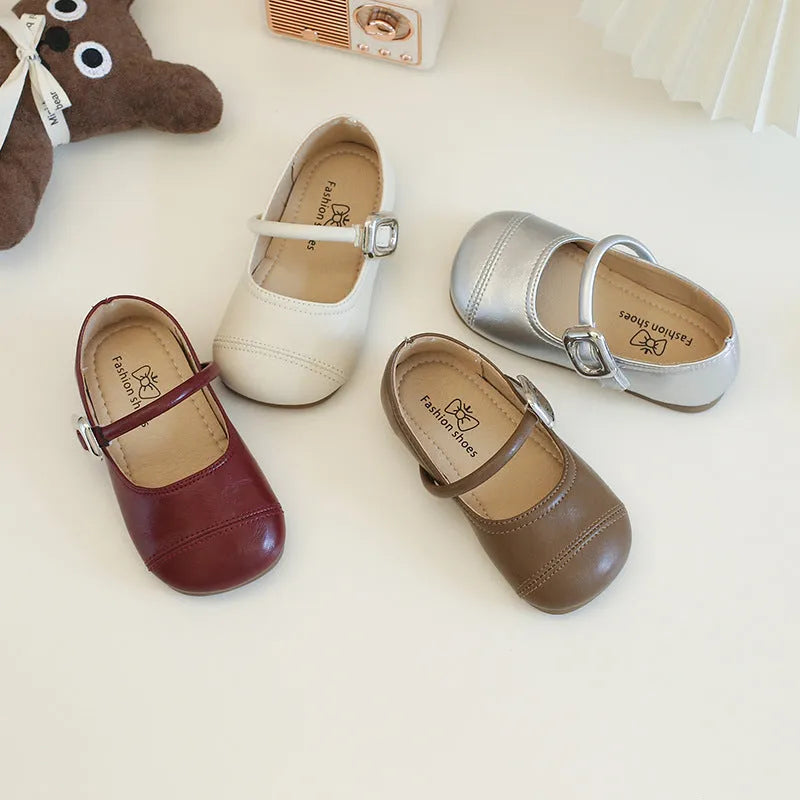 Girls PU leather Mary Jane shoes in solid beige colour with single strap, size 35, side view