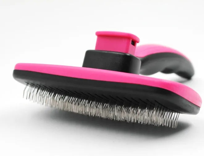 Rose red pet grooming comb with stainless steel teeth on white background