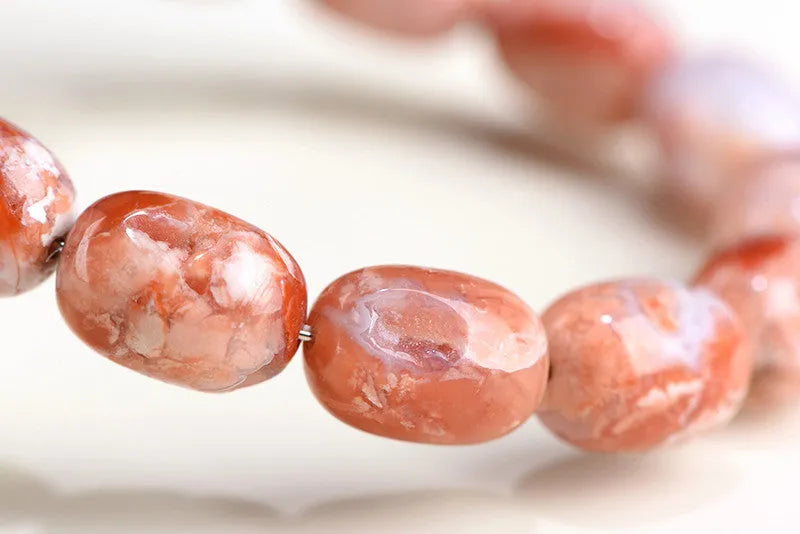 Natural cherry agate barrel bead bracelet with ruyi decorative elements