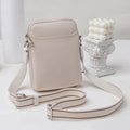 Small solid colour crossbody shoulder bag for mobile phones in beige.
