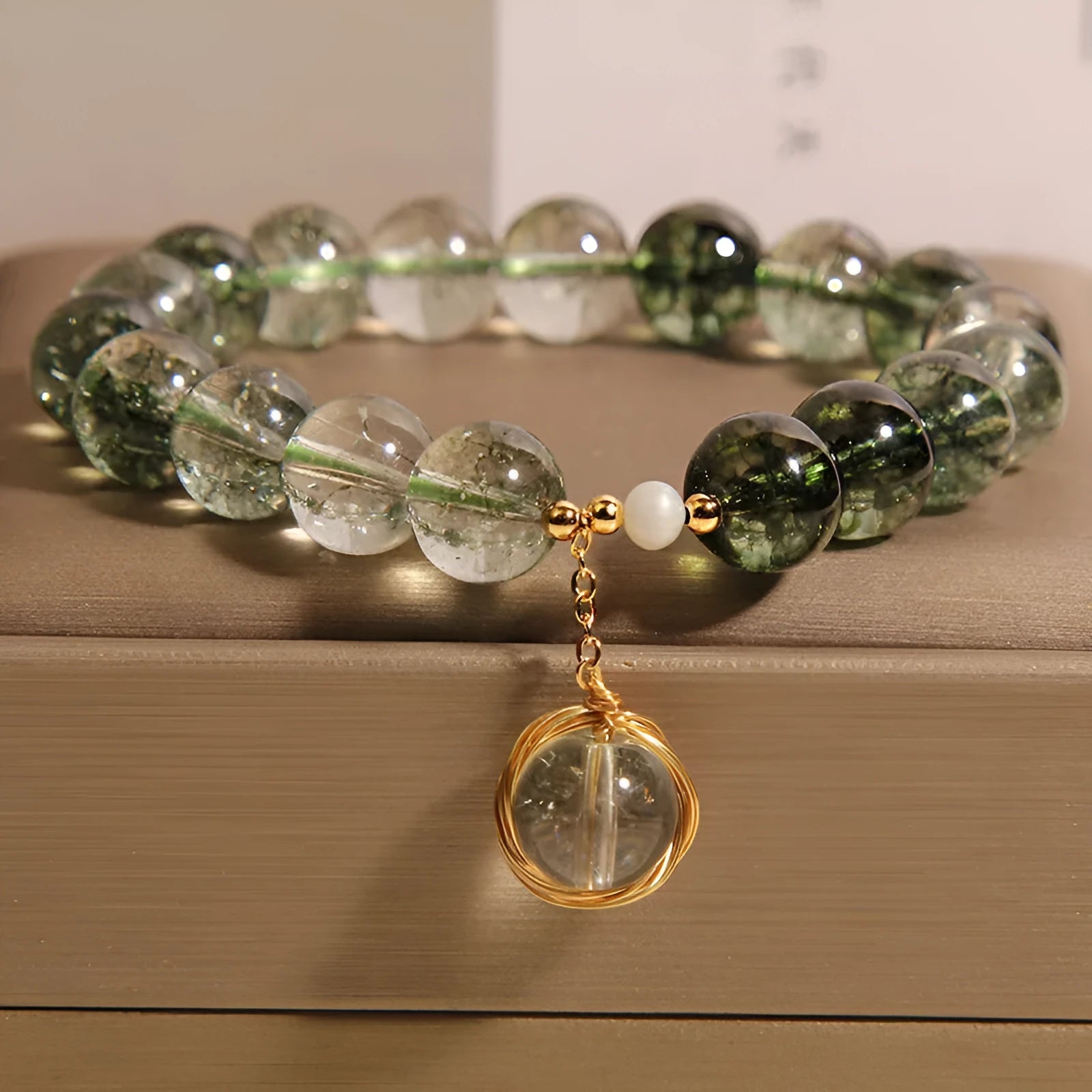 Green phantom quartz and chorite crystal bracelet with winding transfer beads