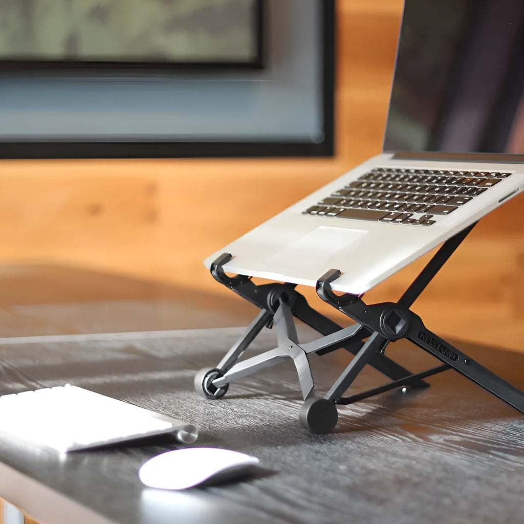 Sagacious black foldable laptop stand made of enhanced nylon, shown open and next to its portable carry bag.