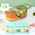 Transparent green vegetable chopper with multiple stainless steel blades and an optional white drain basket on a kitchen counter.