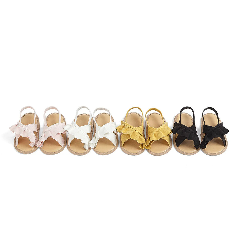 Baby girl toddler shoes with soft bottom, lace, and Velcro closure in white cotton cloth, side view