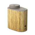 Round plug-in USB nebulizing diffuser in black wood texture with automatic aerosol dispenser and timing function