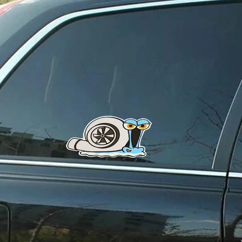 Reflective cartoon snail design car sticker measuring 12 by 8 centimetres.