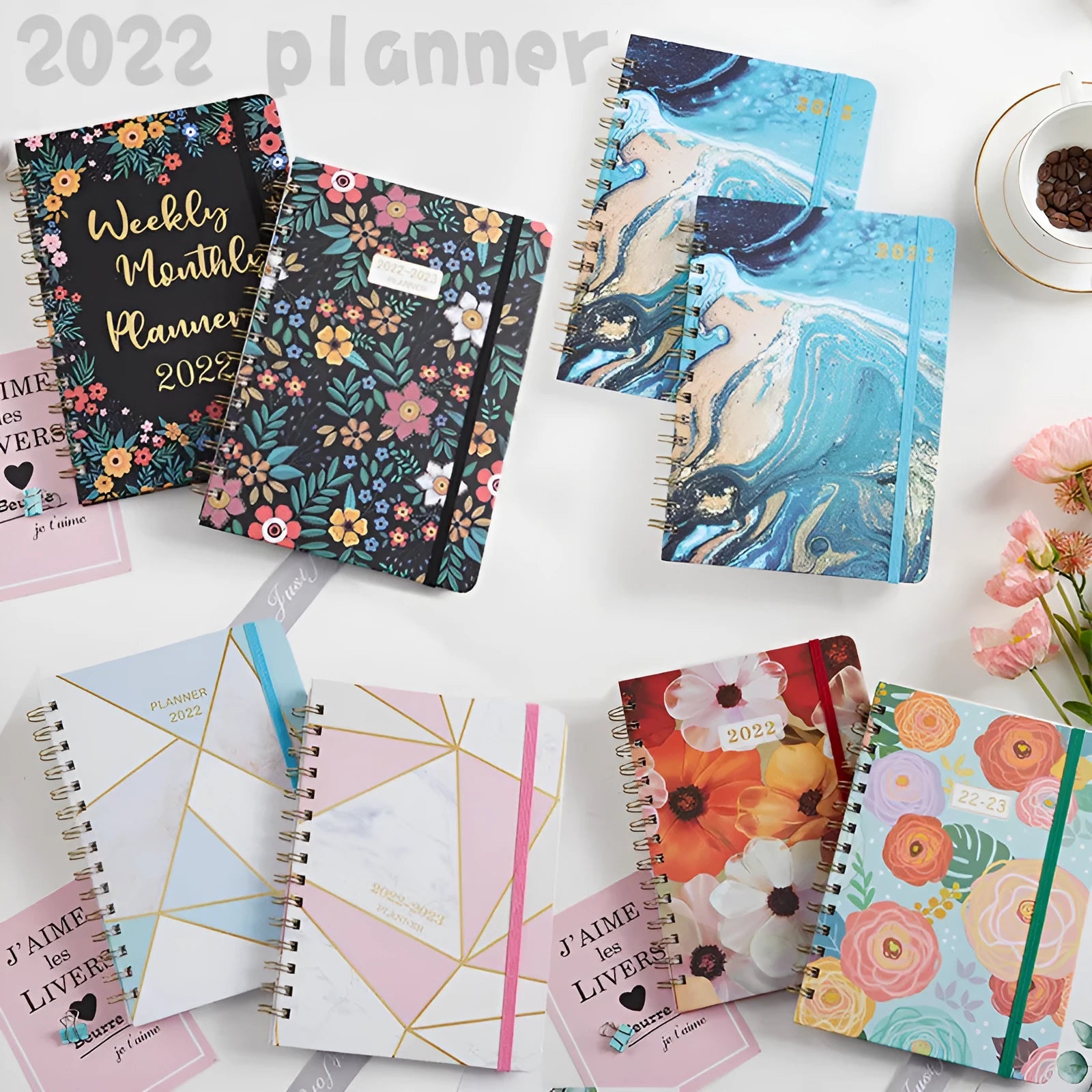A5 spiral notebook with artistic cover design open to show lined pages