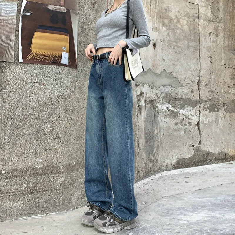 Women's retro blue straight-leg jeans with a high waist on a hanger.