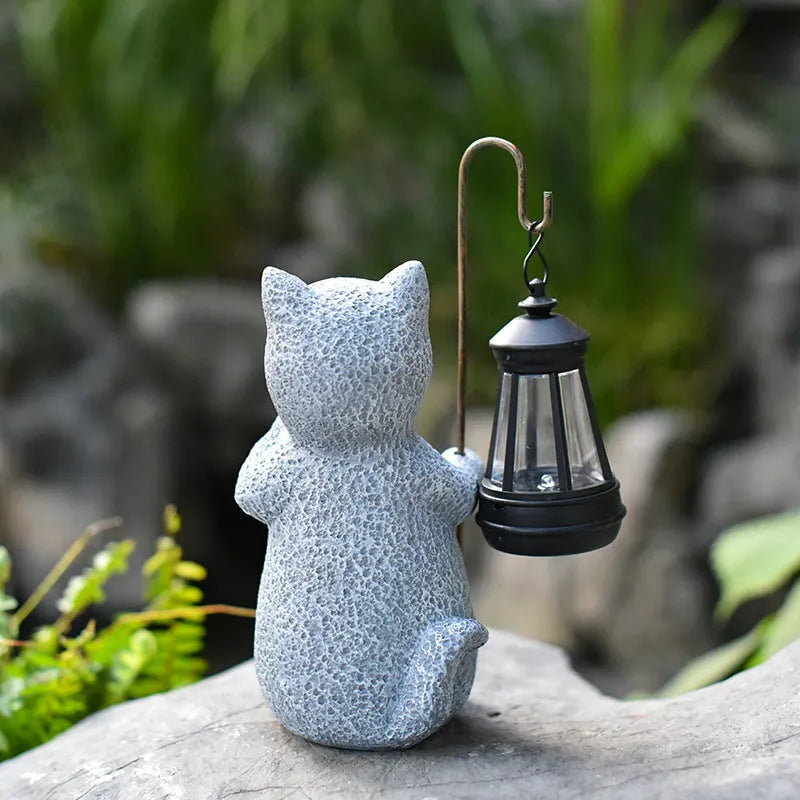 Resin cat lift solar garden lamp with pastoral design and integrated solar panel