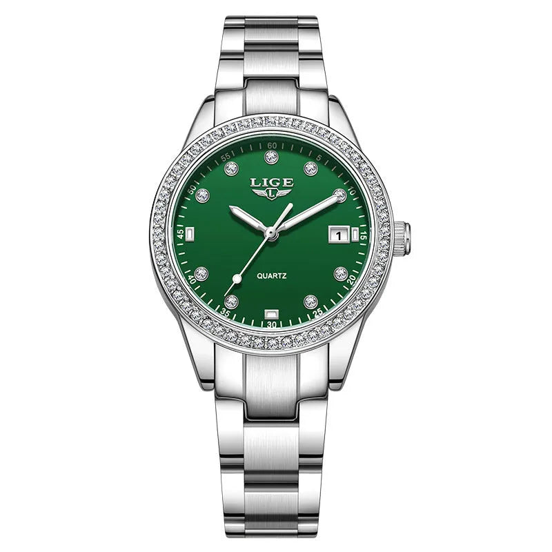 Silver women's fashion watch with diamond bezel, luminous hands on a 34mm round stainless steel dial.
