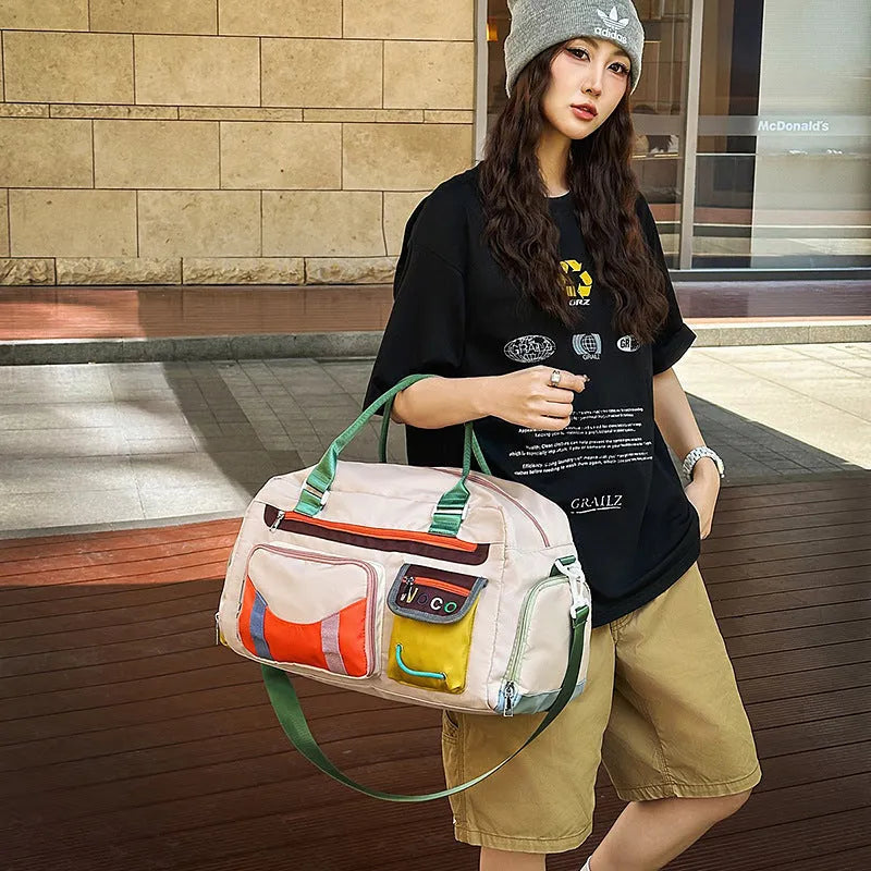 Large black sports shoulder messenger bag with shoulder strap showing exterior dimensions