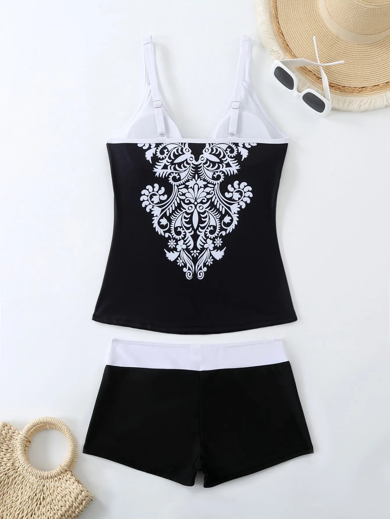 Women's black plus size split print brief swimsuit with a cotton lining.
