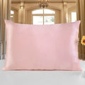 19 momme double-sided silk pillowcase in apricot colour on a bed