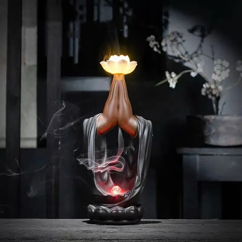 Purple sand tea pet with backflow incense and LED light in Jinglian Tianxiang style on a wooden table