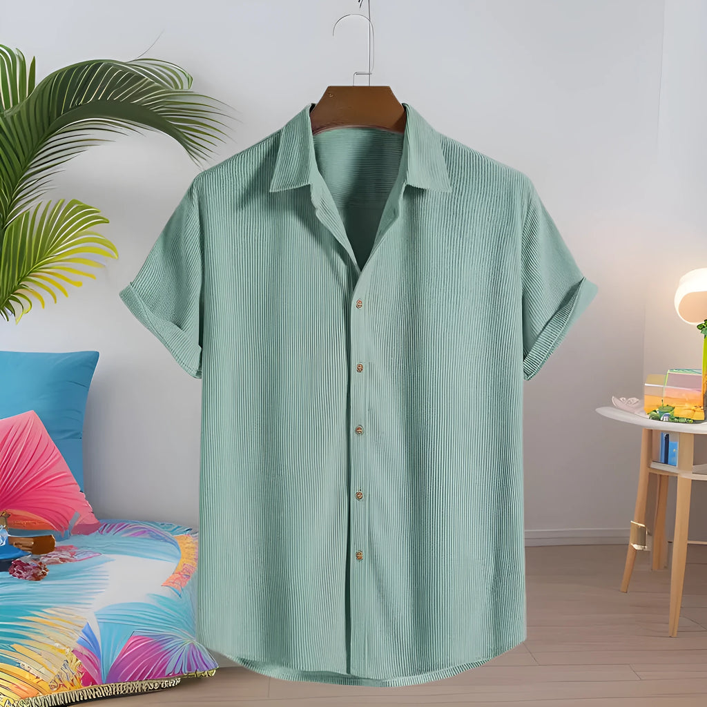Man wearing a casual short-sleeved pink polyester cardigan shirt.