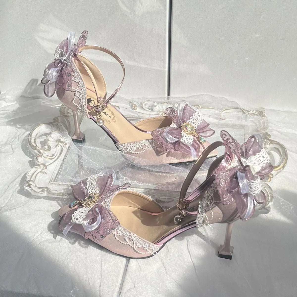 Purple satin women's stiletto shoes with a square toe bracket, shown on a white background.