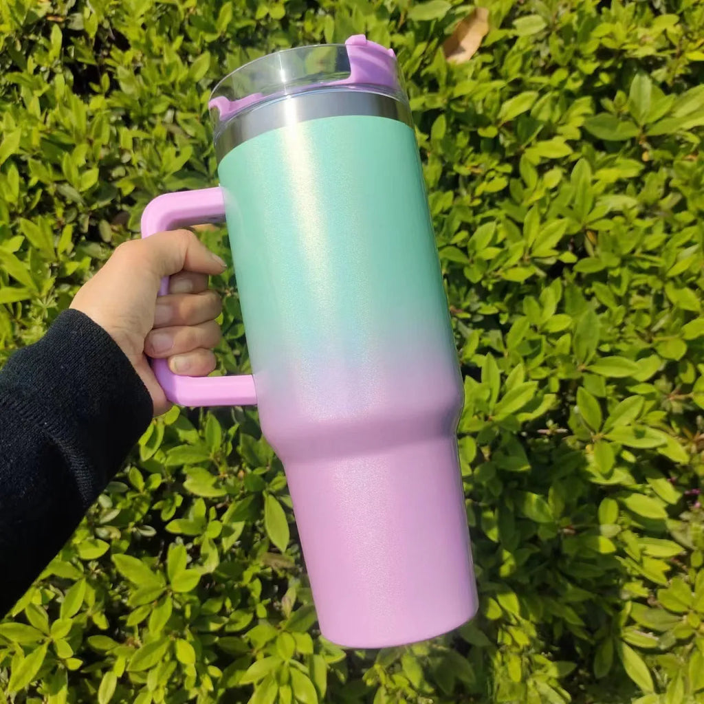 Large stainless steel vacuum insulation cup with gradient colour finish showing thermal retention design