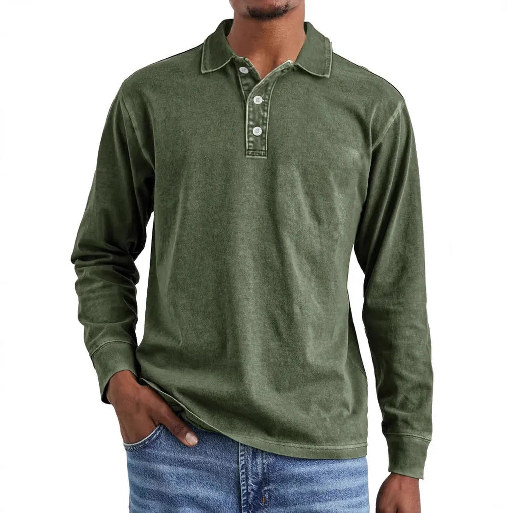 Man wearing a grey washed cotton long sleeve polo shirt with a lapel collar and subtle distressing.