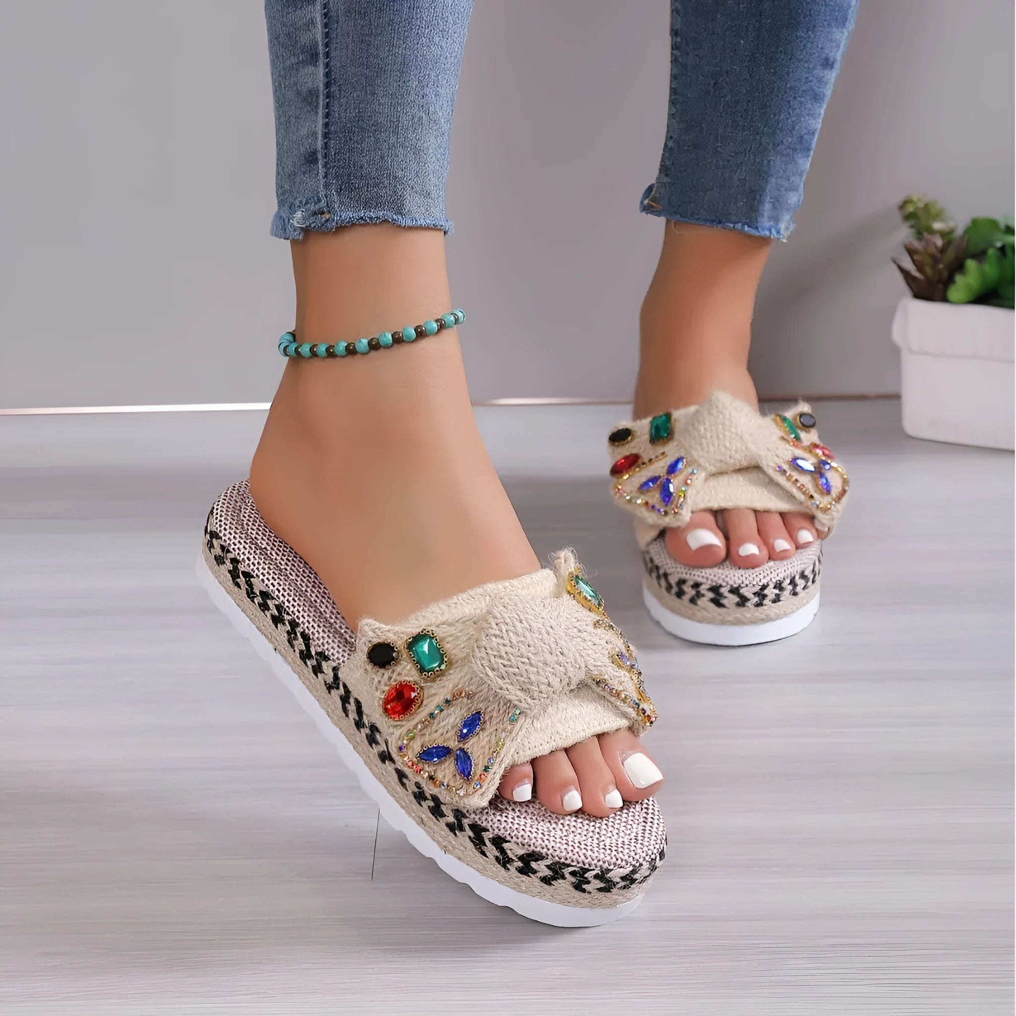 Creamy-white women's platform sandals with a cloth upper, beach bow detail, and a round toe.