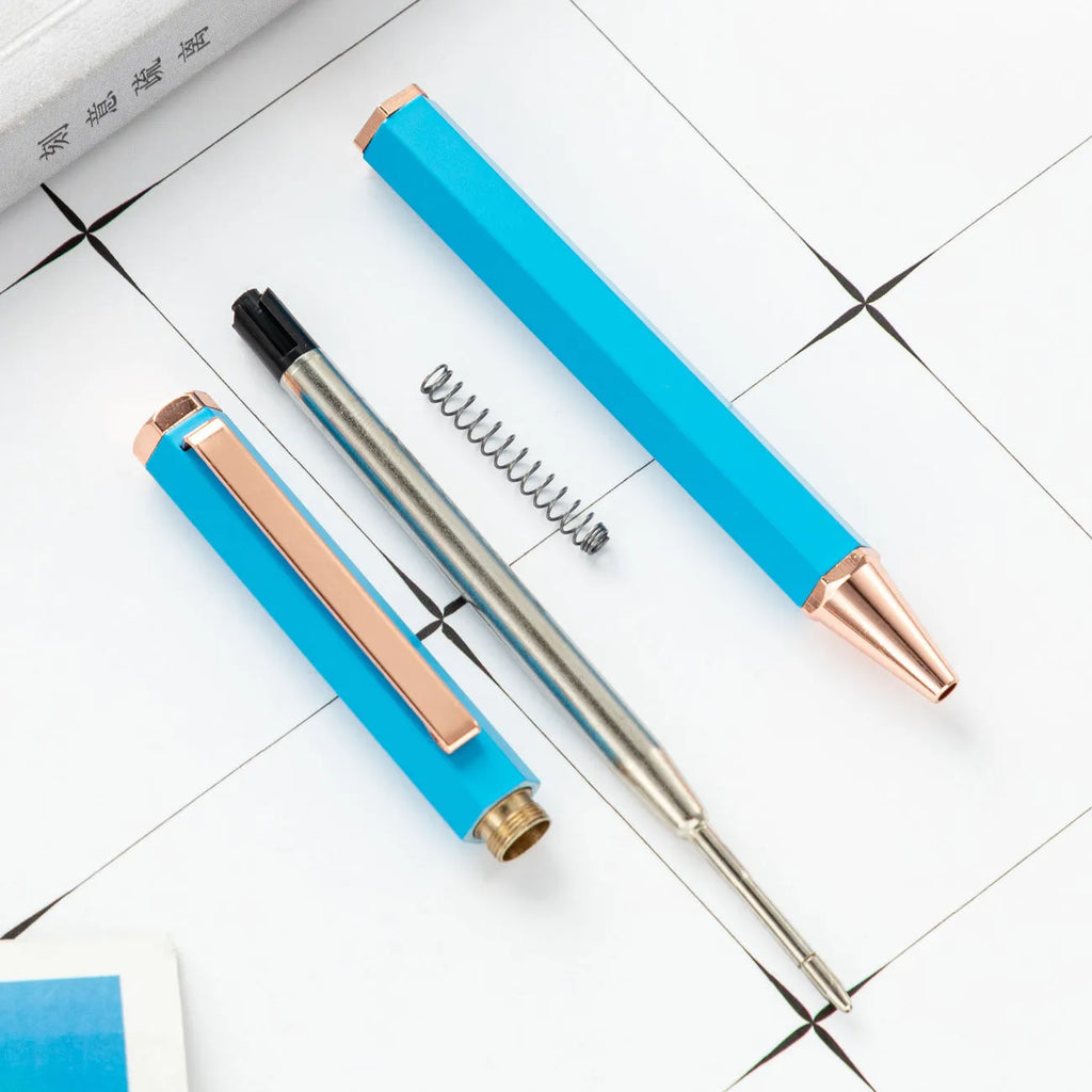 Metal six-angle ballpoint pen in black with 1.0mm bullet tip on white surface
