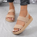 Women's flat wedge beach sandals with elastic band upper and round toe in median brown hemp colour