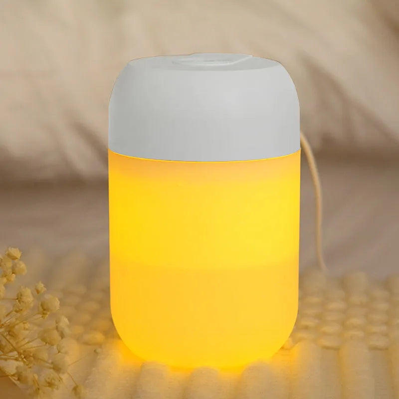 Small white cylindrical USB humidifier for desktop aromatherapy and humidification.