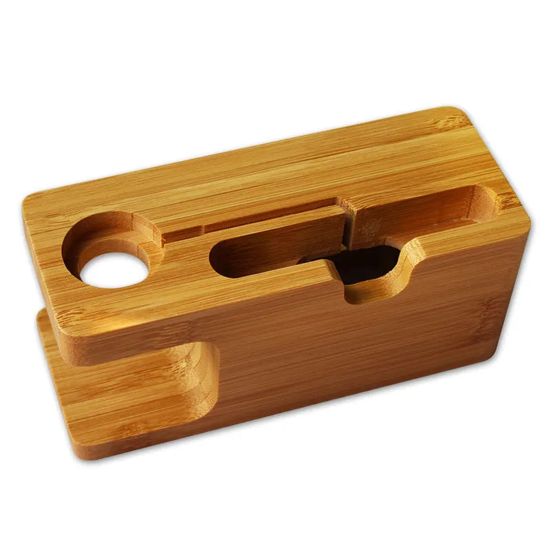 Bamboo desk stand holding a watch and smartphone on an office desk